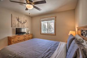 a bedroom with a bed and a ceiling fan at Blue River Condo with Views - 5 Mi to Breckenridge! in Blue River