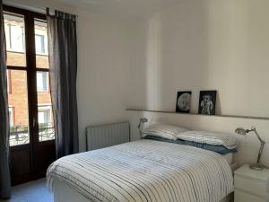 Postel nebo postele na pokoji v ubytování appartamento CITTA' STUDI/No.Lo. + 6 fotografií
