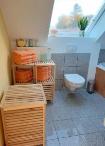 a bathroom with a toilet and a window in it at Luxuriöses Loft mit schönem Blick in Tremsbüttel