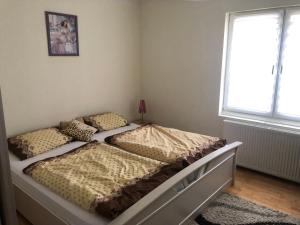 Posteľ alebo postele v izbe v ubytovaní Dom pod barankiem