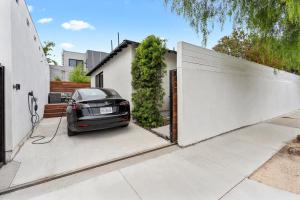 a car parked in front of a garage at Modern Guest Room in Los Angeles