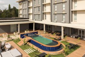 an aerial view of a building with a swimming pool at Protea Hotel by Marriott Owerri Select in Owerri