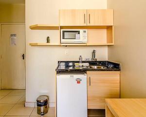 A kitchen or kitchenette at Villa Neves Residence