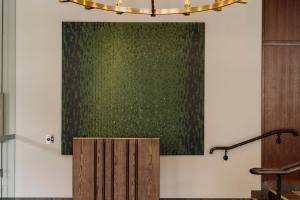 a podium in front of a green wall at The Tasman, a Luxury Collection Hotel, Hobart in Hobart