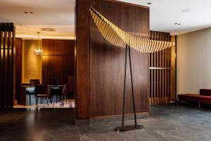 a peacock feather sculpture in a hotel lobby at The Tasman, a Luxury Collection Hotel, Hobart in Hobart