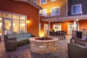 a patio with a fire pit in front of a house at Residence Inn by Marriott Casper in Casper