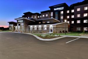 an empty parking lot in front of a hotel at Residence Inn by Marriott Eau Claire in Eau Claire