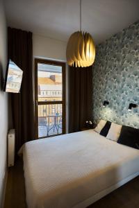 Posteľ alebo postele v izbe v ubytovaní Golden Hour Apartments - Platan Tower