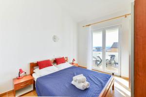 Ein Bett oder Betten in einem Zimmer der Unterkunft Apartments Adria