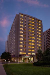 a large building with lights on in a city at Residence Inn by Marriott London Canada in London