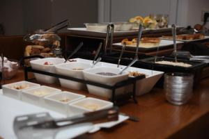a buffet with several dishes of food on a table at Apollon Filoxenia in Korinthos