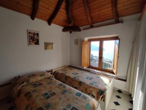 Katil atau katil-katil dalam bilik di Palinuro Romantic panoramico al centro del paese