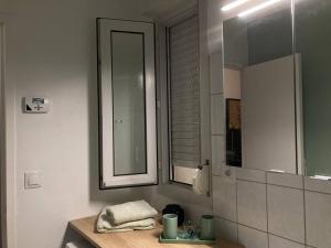 a bathroom with a sink and a mirror at Cozy'Nest in Brest