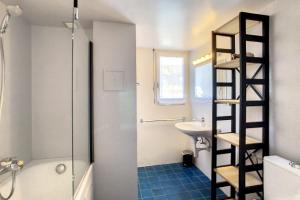 a bathroom with a ladder next to a sink at Ambassador 001 in Verbier