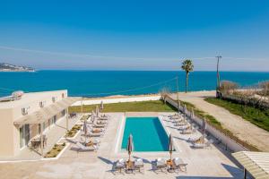 a view of a swimming pool and the ocean at Cinque Terre Iakinthi in Zakynthos Town