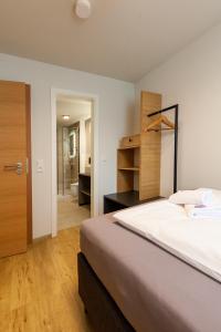 Postel nebo postele na pokoji v ubytování Hotel Garni Traube