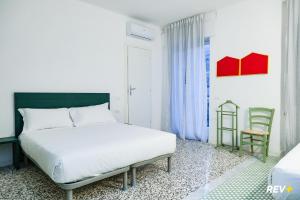 Postel nebo postele na pokoji v ubytování Lia Art Hotel + 37 fotografií