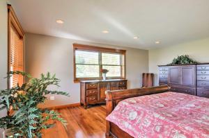 a bedroom with a bed and a dresser and a window at Custom Home with Decks in Boulder! Gateway to Parks! in Boulder Town