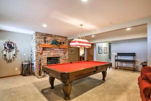 a room with a pool table and a fireplace at Custom Home with Decks in Boulder! Gateway to Parks! in Boulder Town