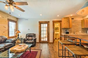 a living room with a couch and a table at Updated Main St Apt Near Fishlake and Capitol Reef! in Salina +17 photos