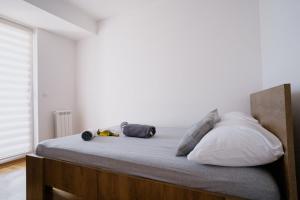 Uma cama ou camas num quarto em Ana Kraljevo
