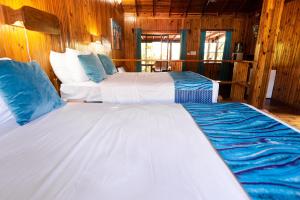 Postel nebo postele na pokoji v ubytování Mango Inn Resort + 26 fotografií