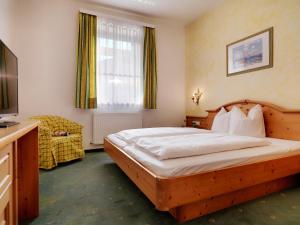 Posteľ alebo postele v izbe v ubytovaní Posthotel Strengen am Arlberg