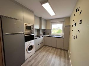 Kuchyň nebo kuchyňský kout v ubytování Apartamento da Fraga
