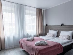 Postel nebo postele na pokoji v ubytování PARK HOTEL VILNIUS