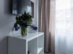 TV a/nebo společenská místnost v ubytování PARK HOTEL VILNIUS