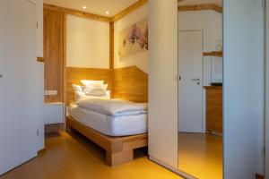 Säng eller sängar i ett rum på Apartmenthaus Erlenbach