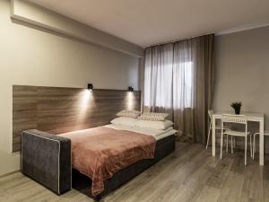 Postel nebo postele na pokoji v ubytování PARK HOTEL VILNIUS