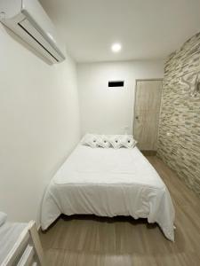 מיטה או מיטות בחדר ב-Casa Vera Cartagena