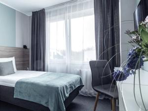 Postel nebo postele na pokoji v ubytování PARK HOTEL VILNIUS