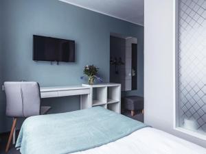 TV a/nebo společenská místnost v ubytování PARK HOTEL VILNIUS