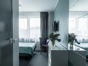 Postel nebo postele na pokoji v ubytování PARK HOTEL VILNIUS
