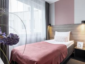 Postel nebo postele na pokoji v ubytování PARK HOTEL VILNIUS