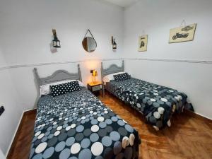 Posteľ alebo postele v izbe v ubytovaní Casa Loli - solo familias y parejas