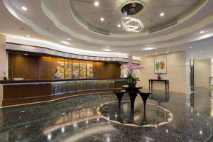 a lobby with a reception desk in a building at Rosedale Hotel Hong Kong in Hong Kong