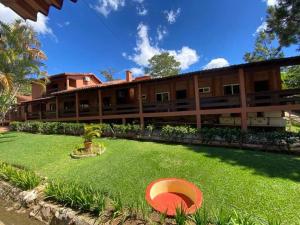 a large building with a large lawn in front of it at Bama House hn in Valle de Ángeles