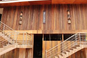 a building with stairs on the side of it at Golden Crystal Experience Hotel in Accra