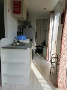 a kitchen with a sink and a counter top at trigano sublima in Litteau