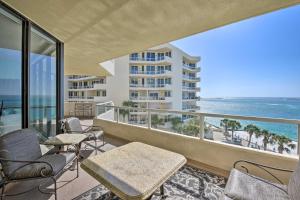 a balcony with tables and chairs and a view of the ocean at Gulf View Destin Condo with Resort Pool and Spa! in Destin