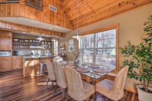 a kitchen and dining room with a table and chairs at Pet-Friendly Grand Lake House with Dock and Kayaks! in Eucha