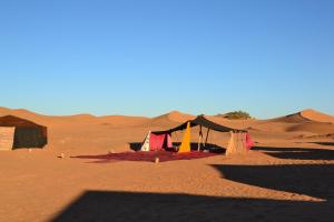 a tent in the middle of the desert at Camp Mbark authentic in Mhamid
