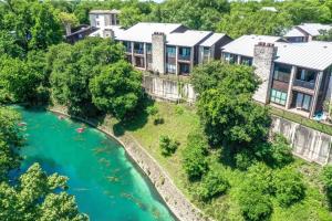 an aerial view of a resort with a river at CW CH Camp Warnecke Club Haus in New Braunfels