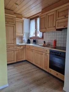 Kuchyň nebo kuchyňský kout v ubytování Melchsee-Frutt, Graustock, Wohnung 13