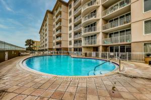 a swimming pool in front of a apartment building at Island Princess 704 in Fort Walton Beach