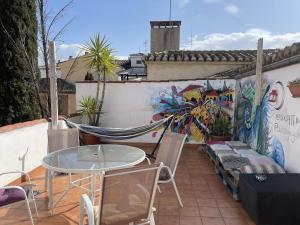 A balcony or terrace at El Granado Hostel