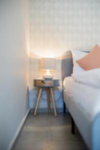 Posteľ alebo postele v izbe v ubytovaní MarineLake Apartman Balatonföldvár By BLTN